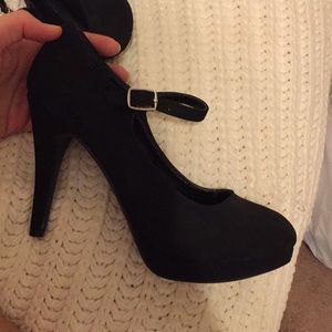 Black pumps with strap across foot Clearance